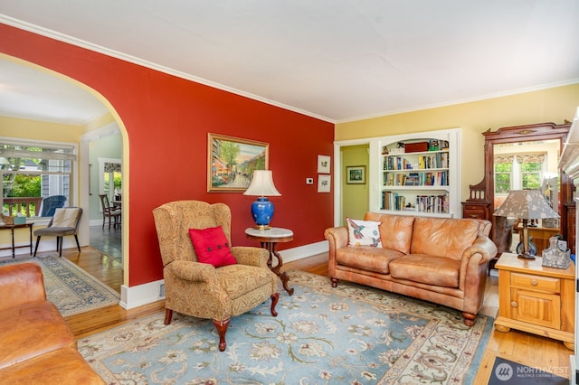 1833 3rd Ave, Kirkland, WA 98033 - living room with arched walkways, wood finished floors, and ornamental molding