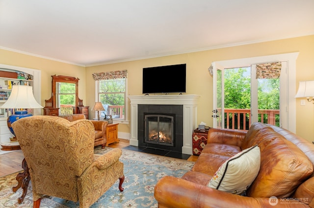 1833 3rd Ave, Kirkland, WA 98033 - living room with wood finished floors, crown molding, and a tiled fireplace