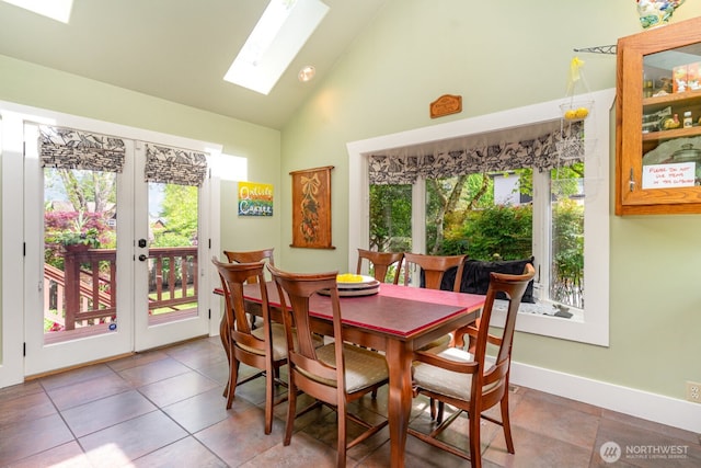 1833 3rd Ave, Kirkland, WA 98033 - dining room with a skylight, high vaulted ceiling, and tile patterned flooring
