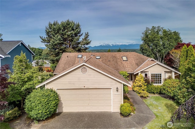 20135 Bue Rund Loop NE, Poulsbo, WA 98370 - view of front of home featuring a garage and asphalt driveway