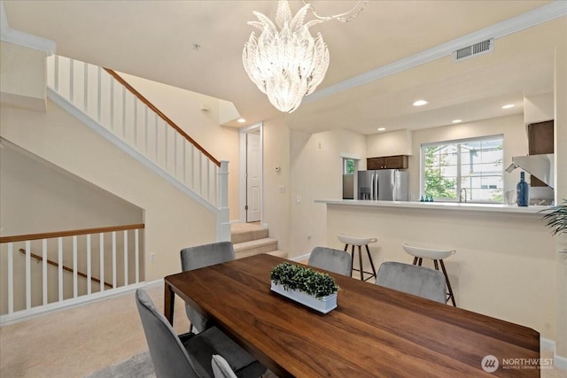 1980 132nd Ave SE Unit 40, Bellevue, WA 98005 - dining space featuring a chandelier, stairs, carpet flooring, baseboards, and recessed lighting