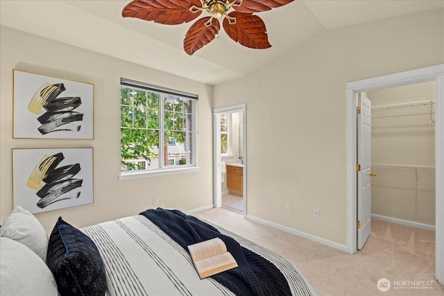 1980 132nd Ave SE Unit 40, Bellevue, WA 98005 - bedroom featuring light carpet, baseboards, a walk in closet, vaulted ceiling, and ensuite bath