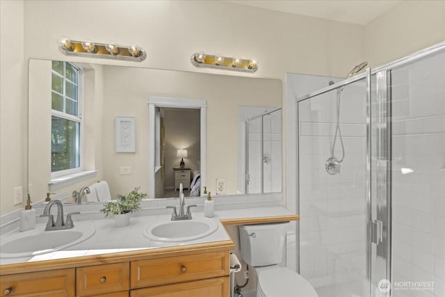 1980 132nd Ave SE Unit 40, Bellevue, WA 98005 - bathroom featuring double vanity, a stall shower, and toilet