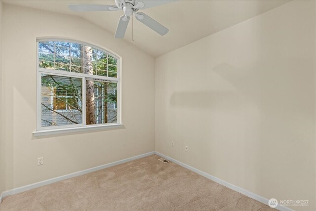 1980 132nd Ave SE Unit 40, Bellevue, WA 98005 - carpeted empty room with lofted ceiling, baseboards, and ceiling fan