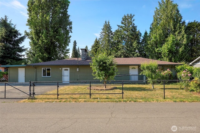 6836 Husky Way SE, Olympia, WA 98503 - ranch-style house with a chimney and a fenced front yard