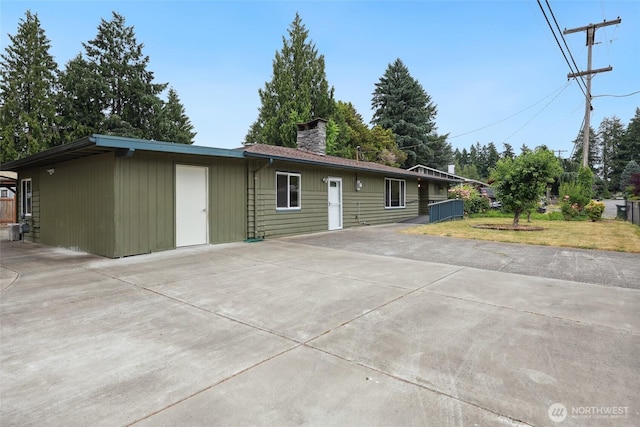6836 Husky Way SE, Olympia, WA 98503 - ranch-style home with a chimney and a patio
