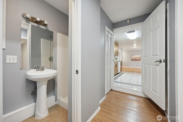 6836 Husky Way SE, Olympia, WA 98503 - bathroom featuring a shower and wood finished floors