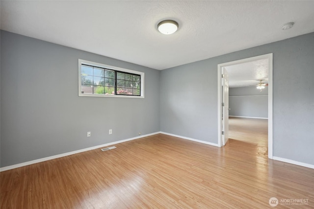 6836 Husky Way SE, Olympia, WA 98503 - spare room with light wood-style flooring and a smoke detector