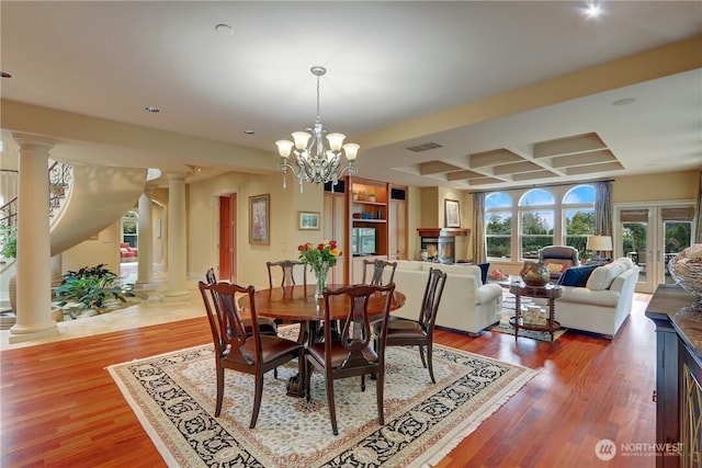1055 91st Ave NE, Bellevue, WA 98004 - dining room with ornate columns, coffered ceiling, wood finished floors, beamed ceiling, and recessed lighting