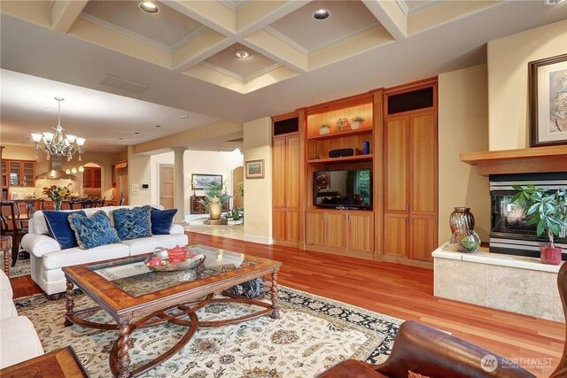 1055 91st Ave NE, Bellevue, WA 98004 - living area with light wood-style flooring, coffered ceiling, beamed ceiling, a multi sided fireplace, and recessed lighting