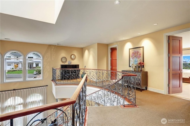 1055 91st Ave NE, Bellevue, WA 98004 - hallway featuring an upstairs landing, healthy amount of natural light, carpet flooring, recessed lighting, and baseboards