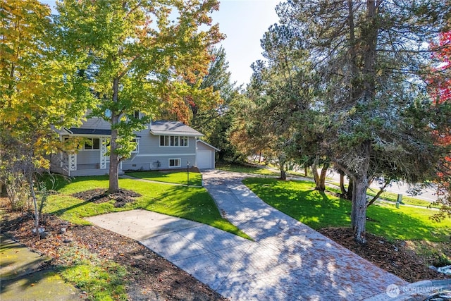 1106 Starling St, Steilacoom, WA 98388 - view of front of property with a front yard, a garage, and driveway