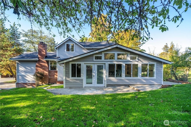 1106 Starling St, Steilacoom, WA 98388 - back of house with a yard, a patio, a chimney, and french doors