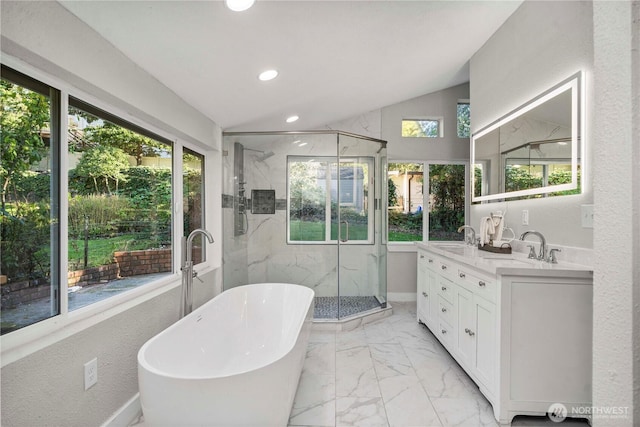 1106 Starling St, Steilacoom, WA 98388 - full bathroom featuring marble look tile flooring, a freestanding tub, a marble finish shower, double vanity, and recessed lighting