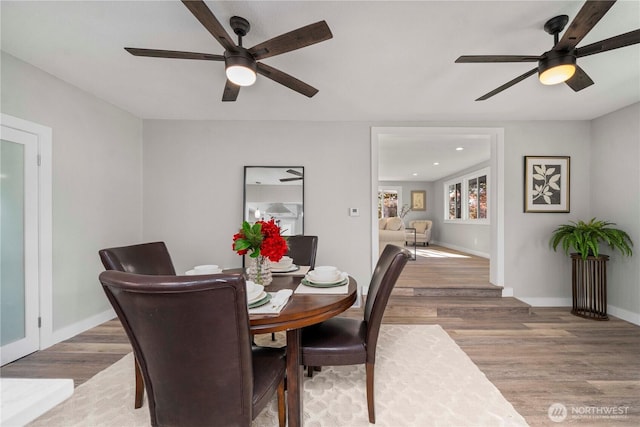1106 Starling St, Steilacoom, WA 98388 - dining area with ceiling fan, wood finished floors, and baseboards