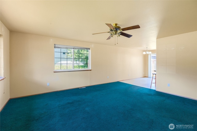 2376 Nicholas Dr, Ferndale, WA 98248 - carpeted empty room with a ceiling fan and a chandelier