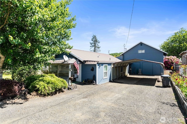 414 S Main, Mccleary, WA 98557 - view of front of home with a detached carport, driveway, and metal roof