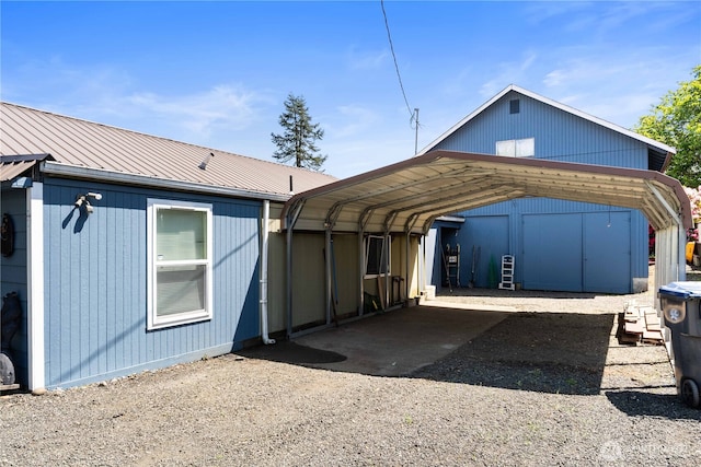 414 S Main, Mccleary, WA 98557 - rear view of house featuring a detached carport, metal roof, and driveway