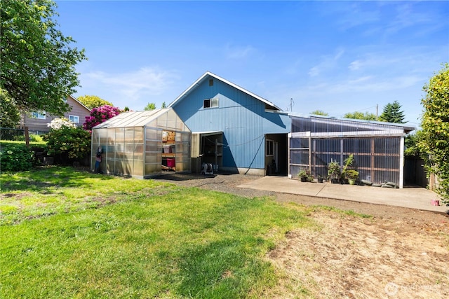 414 S Main, Mccleary, WA 98557 - rear view of house featuring a greenhouse and an outbuilding