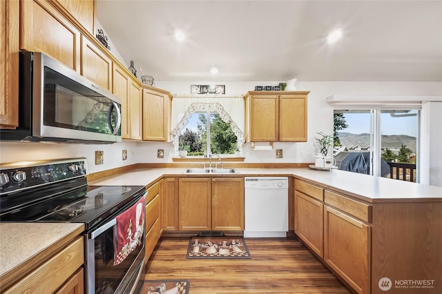 2427 Bellanca Ct, East Wenatchee, WA 98802 - kitchen featuring electric stove, white dishwasher, stainless steel microwave, a peninsula, and light countertops