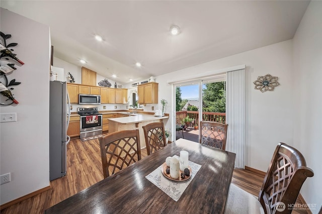 2427 Bellanca Ct, East Wenatchee, WA 98802 - dining room with light wood-style floors, vaulted ceiling, and recessed lighting