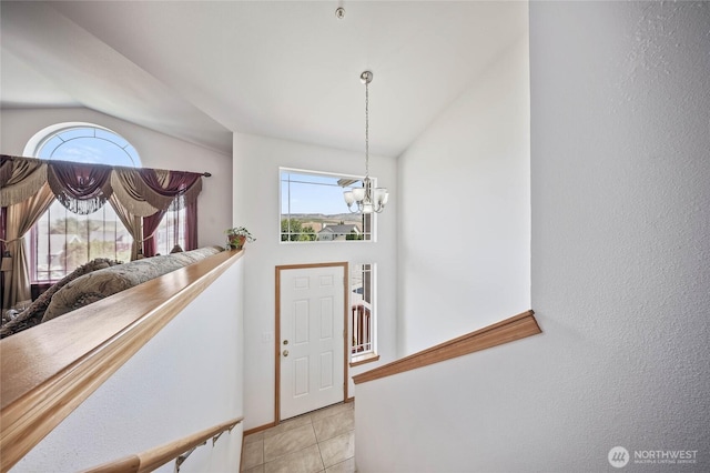 2427 Bellanca Ct, East Wenatchee, WA 98802 - entryway with a chandelier, vaulted ceiling, and light tile patterned flooring
