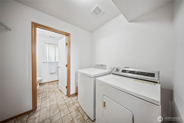 2427 Bellanca Ct, East Wenatchee, WA 98802 - laundry area with separate washer and dryer and stone finish flooring