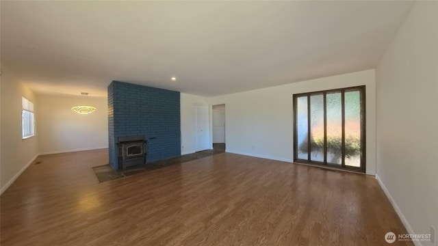 30022 2nd Pl SW, Federal Way, WA 98032 - unfurnished living room with baseboards and wood finished floors