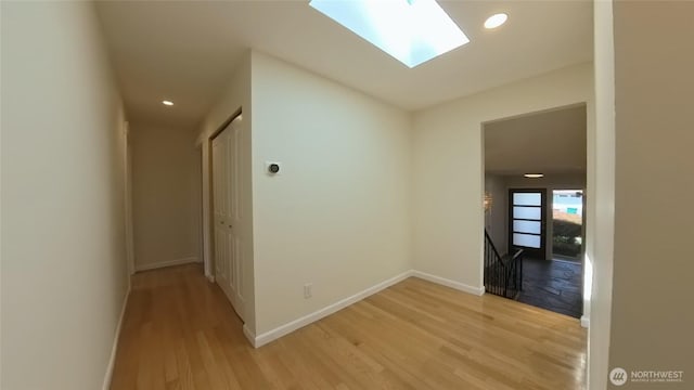 30022 2nd Pl SW, Federal Way, WA 98032 - hall with an upstairs landing, light wood-style flooring, a skylight, and recessed lighting