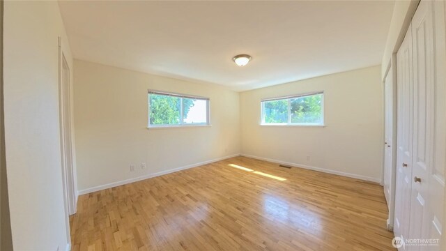30022 2nd Pl SW, Federal Way, WA 98032 - unfurnished bedroom with light wood-style floors and baseboards