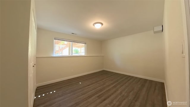 30022 2nd Pl SW, Federal Way, WA 98032 - unfurnished room featuring baseboards and dark wood-style flooring