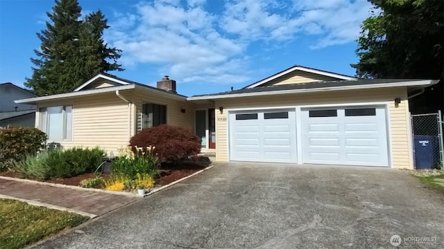 30022 2nd Pl SW, Federal Way, WA 98032 - ranch-style home with asphalt driveway, a chimney, and an attached garage
