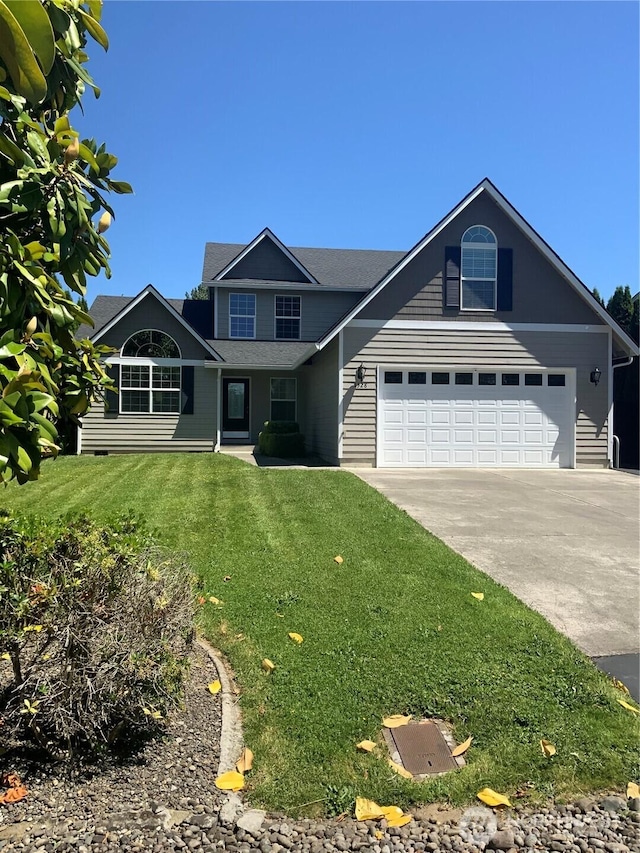 3328 Pennsylvania, Longview, WA 98632 - view of front of house featuring concrete driveway and a front lawn