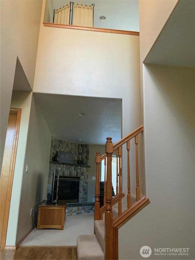 3328 Pennsylvania, Longview, WA 98632 - living area with a stone fireplace, stairway, wood finished floors, and a high ceiling