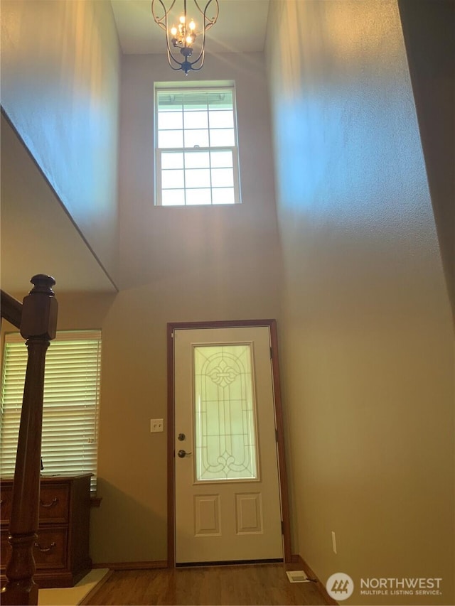 3328 Pennsylvania, Longview, WA 98632 - entryway with a towering ceiling, a chandelier, and light wood-style flooring