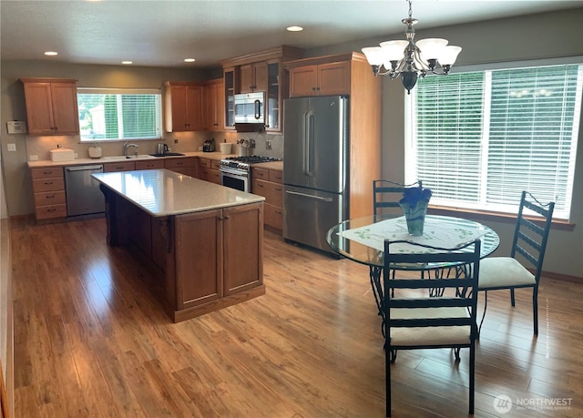 3328 Pennsylvania, Longview, WA 98632 - kitchen with stainless steel appliances, a chandelier, light wood-style flooring, and recessed lighting
