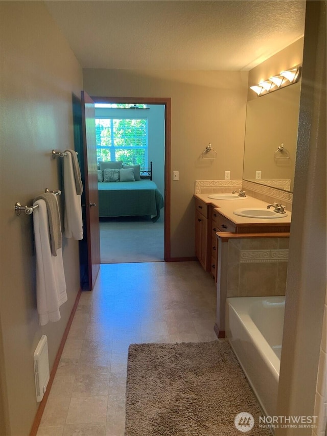 3328 Pennsylvania, Longview, WA 98632 - full bath with connected bathroom, double vanity, and a textured ceiling
