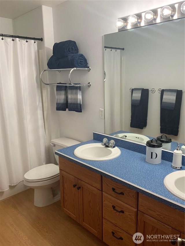 3328 Pennsylvania, Longview, WA 98632 - bathroom featuring double vanity, wood finished floors, and curtained shower