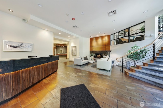 5450 Leary Ave NW Unit 251, Seattle, WA 98107 - welcome area with a large fireplace, stairs, and recessed lighting