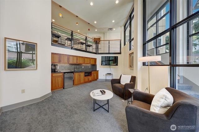 5450 Leary Ave NW Unit 251, Seattle, WA 98107 - living room featuring carpet floors, a towering ceiling, baseboards, and recessed lighting