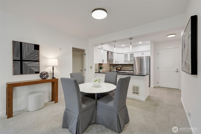 5450 Leary Ave NW Unit 251, Seattle, WA 98107 - dining room featuring light carpet, baseboards, and recessed lighting