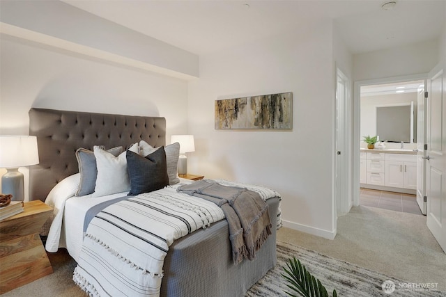 5450 Leary Ave NW Unit 251, Seattle, WA 98107 - bedroom with light carpet, baseboards, and a sink