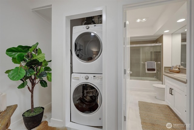 5450 Leary Ave NW Unit 251, Seattle, WA 98107 - laundry area featuring stacked washer / dryer and recessed lighting