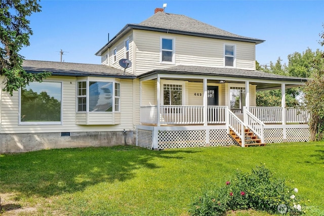 449 NE Cliff Ave, Wilbur, WA 99185 - view of front of property featuring a porch, a front yard, crawl space, and a chimney