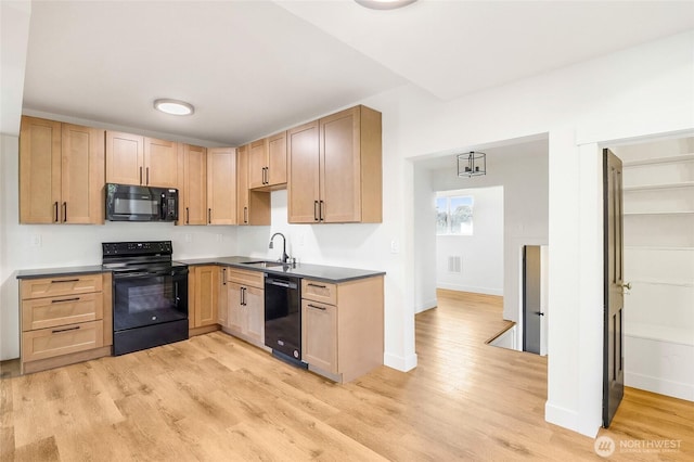 449 NE Cliff Ave, Wilbur, WA 99185 - kitchen with black appliances, a sink, light brown cabinets, light wood-style floors, and baseboards