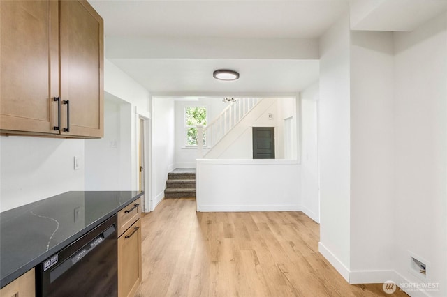 449 NE Cliff Ave, Wilbur, WA 99185 - kitchen with black dishwasher, light wood finished floors, baseboards, and dark stone countertops