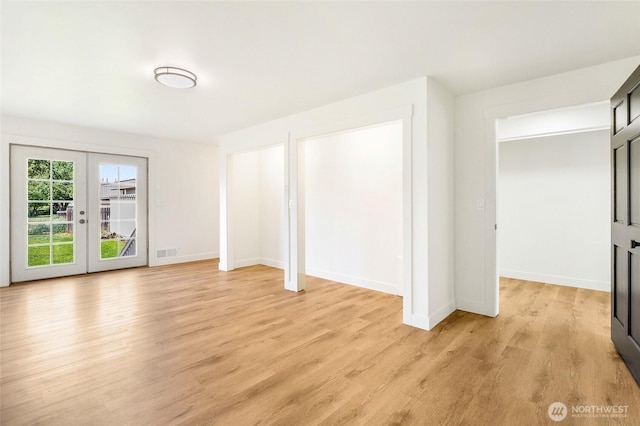 449 NE Cliff Ave, Wilbur, WA 99185 - unfurnished bedroom with light wood-style floors, baseboards, french doors, and access to outside