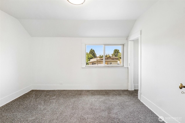 449 NE Cliff Ave, Wilbur, WA 99185 - empty room with vaulted ceiling, carpet floors, and baseboards