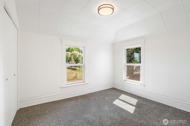 449 NE Cliff Ave, Wilbur, WA 99185 - unfurnished room with carpet floors and lofted ceiling