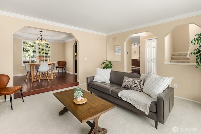 600 213th St SW, Bothell, WA 98021 - living room featuring arched walkways, ornamental molding, a chandelier, carpet flooring, and stairs